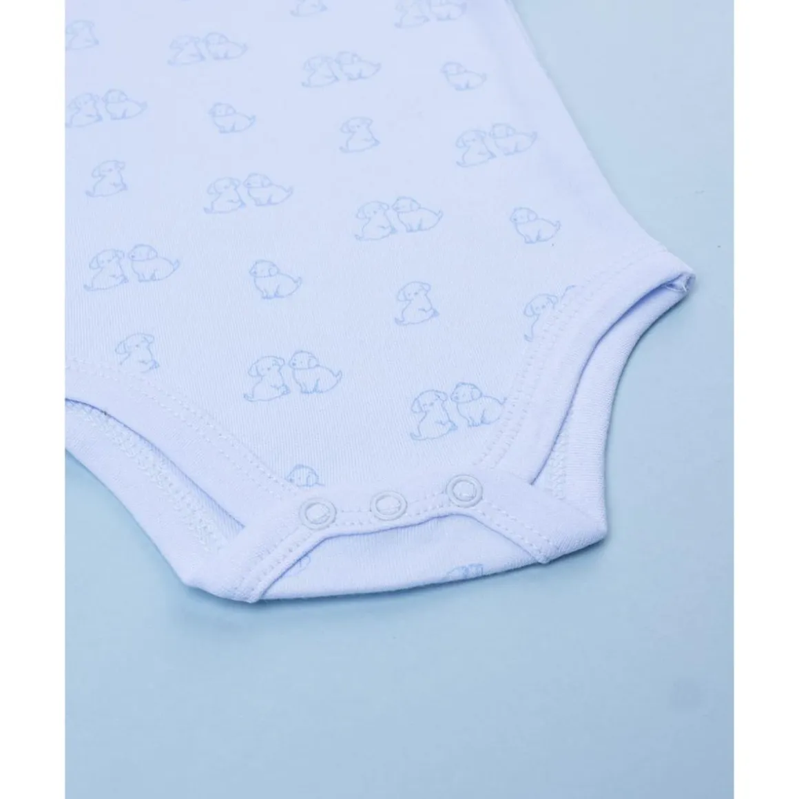 Body de bebé en algodón blanco con estampado de perritos