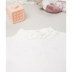 Body niña blanco con volante en el cuello