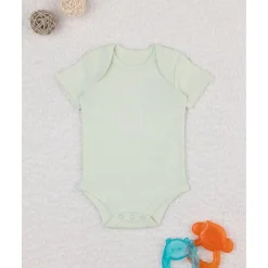 Body niña verde con flores estilizadas