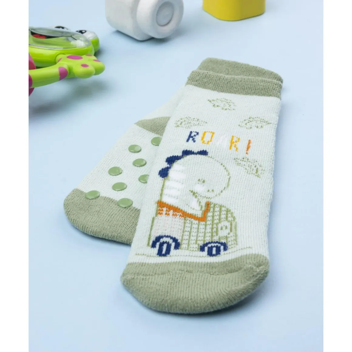 Calcetines antideslizantes de niño verdes con dinosaurio