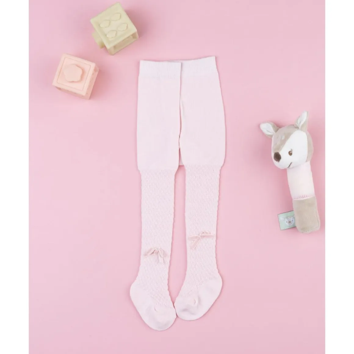 Leotardo rosa de recién nacida con lazo