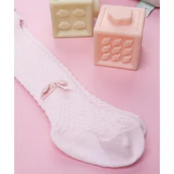 Leotardo rosa de recién nacida con lazo