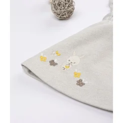 Peto con falda niña beige con bordados